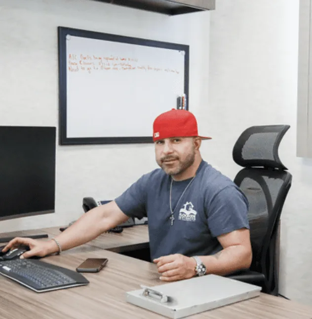 Andy of Floodcide Restoration at his desk