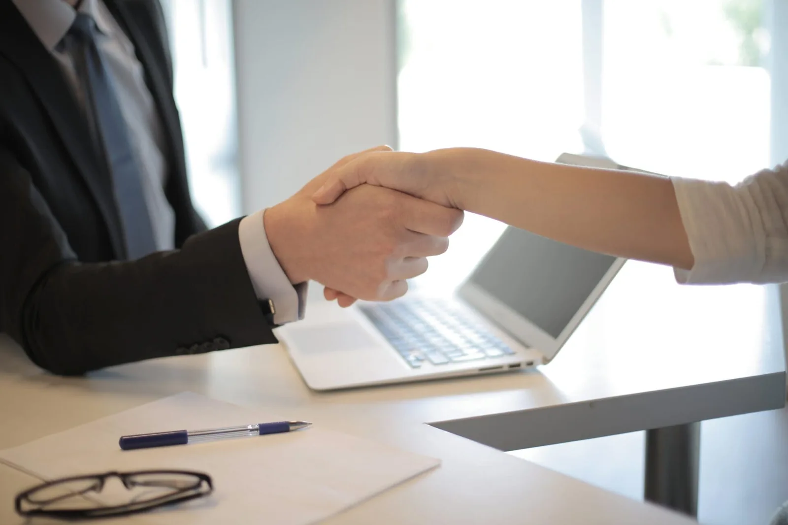 A man and a woman shaking hands